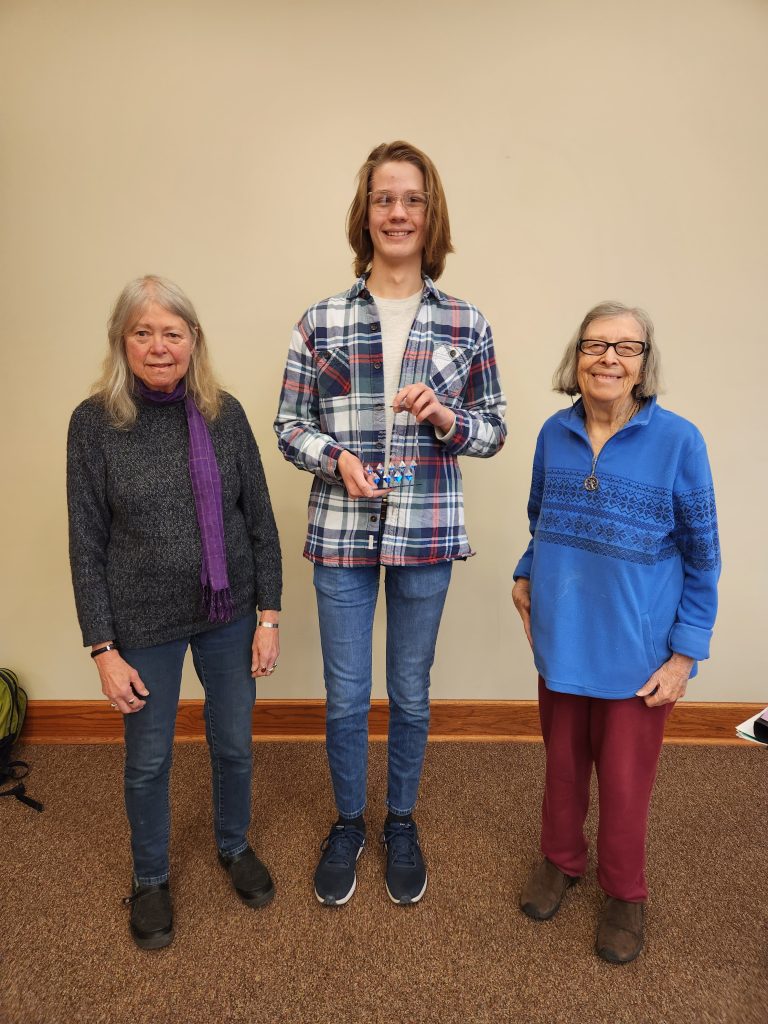 Eli Jones receives Rosa Parks student award from Mary Jo Hamilton and Joann Muneta